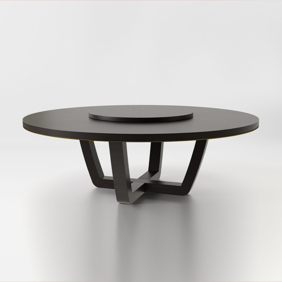 A round dining table finished in a high gloss dark tinted oak with an antiqued brushed brass trim and a central turntable. Design by DAVIDSON London.