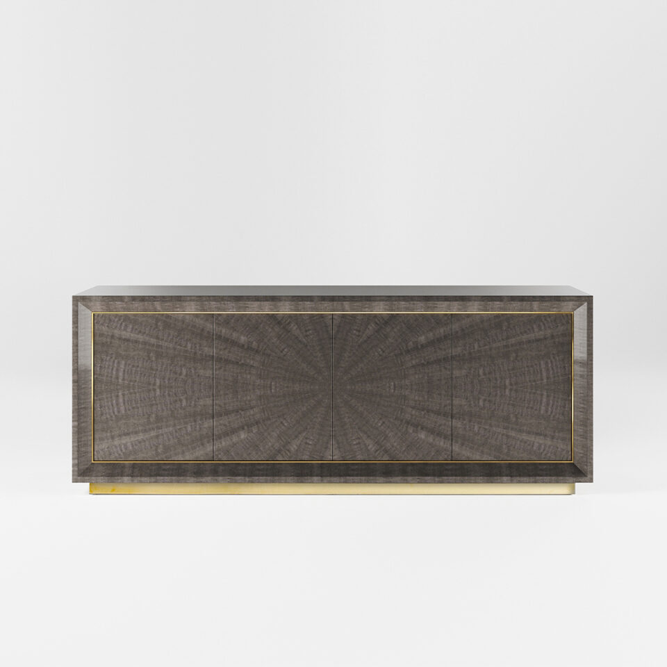 A four door sideboard finished in a high gloss Pebble Grey Anegre with a polished brass plinth and trim. Design by DAVIDSON London.