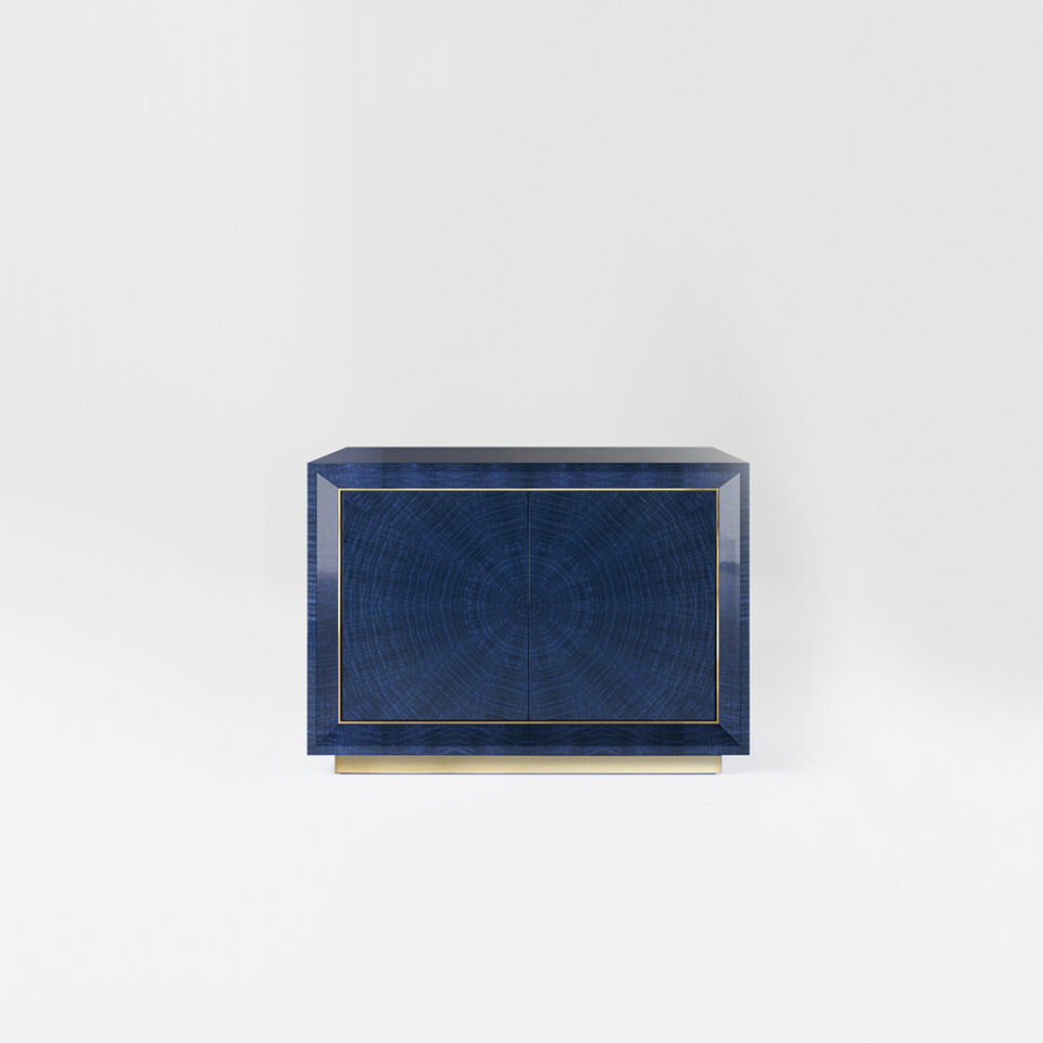 A two door sideboard finished in a high gloss Figured Blue Eucalyptus with a polished brass plinth and trim. Design by DAVIDSON London.