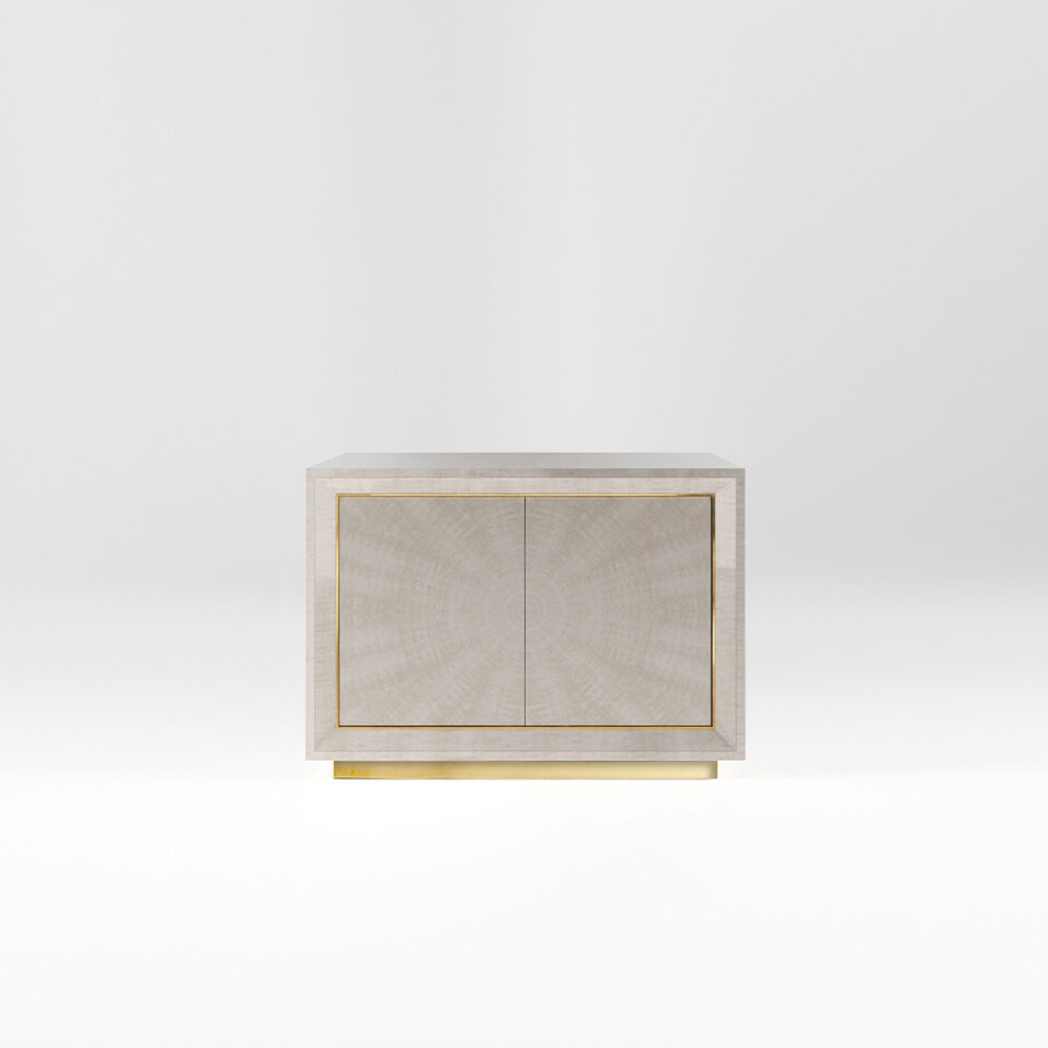 A two door sideboard finished in a high gloss Sycamore Silk with a polished brass plinth and trim. Design by DAVIDSON London.