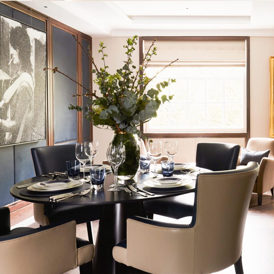 A stunning dining or centre table of contemporary design that will transform any interior with its sleek slimline top and chic silhouette. Geometrically intriguing with the contrasting curves of the spherical top and conical base, shown here in a sublime bronze finish. Interior design by Linley.