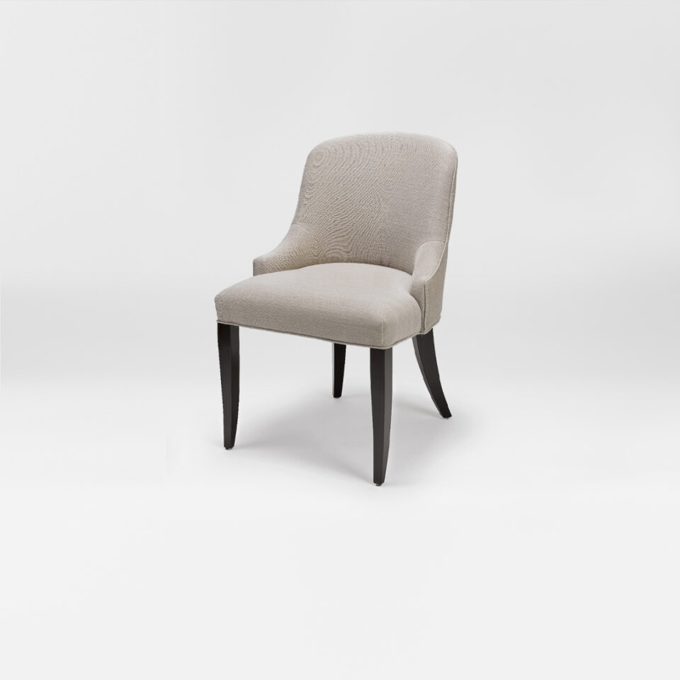 A luxury low back dining chair. Upholstered in a soft metallic cream wool with satin tinted beech legs. Design by DAVIDSON London