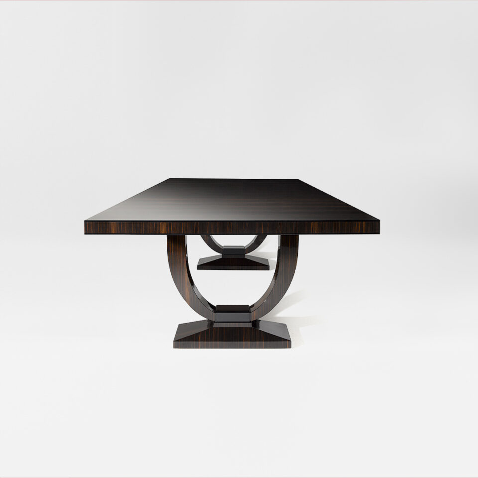 A contemporary rectangular dining table in macassar ebony with an ebonised black lacquer pedestal detail. Front view. Design by DAVIDSON London.