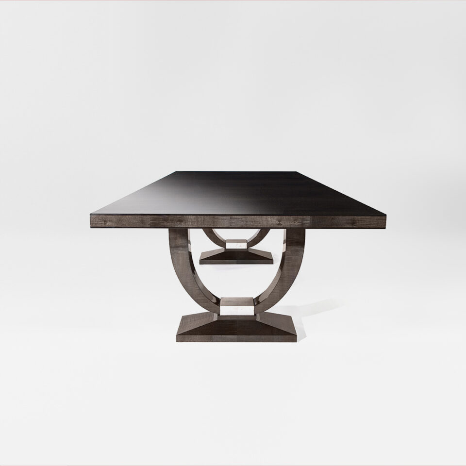 A contemporary rectangular dining table in sycamore black with a distressed white gold leaf gilded block pedestal detail. Design by DAVIDSON London
