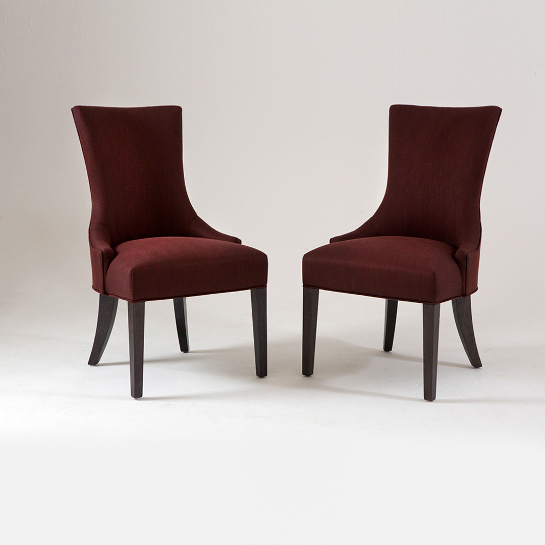 A luxury Dining chair pair with a high back. Upholstered in a soft silver fabric with satin tinted beech legs. Design by DAVIDSON London