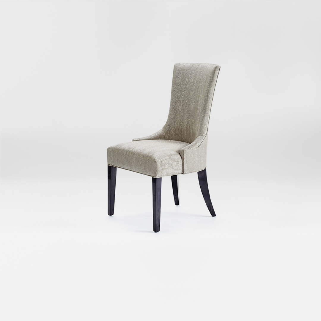 A luxury Dining chair with a high back. Upholstered in a soft silver fabric with satin tinted beech legs. Design by DAVIDSON London. Side view.
