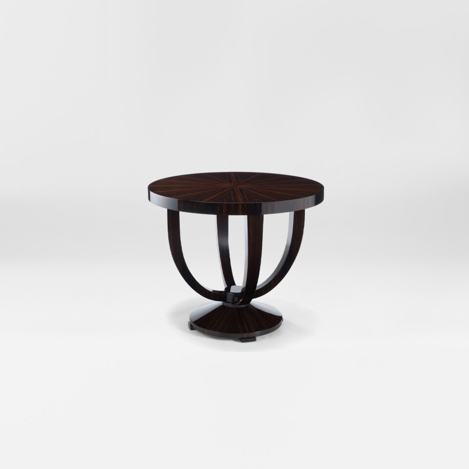 An elegant occasional table with a radial pattern tabletop that sits on a pedestal of four tapered legs anchored with an ebonised block. Finished in a high gloss macassar ebony. Design by DAVIDSON London.