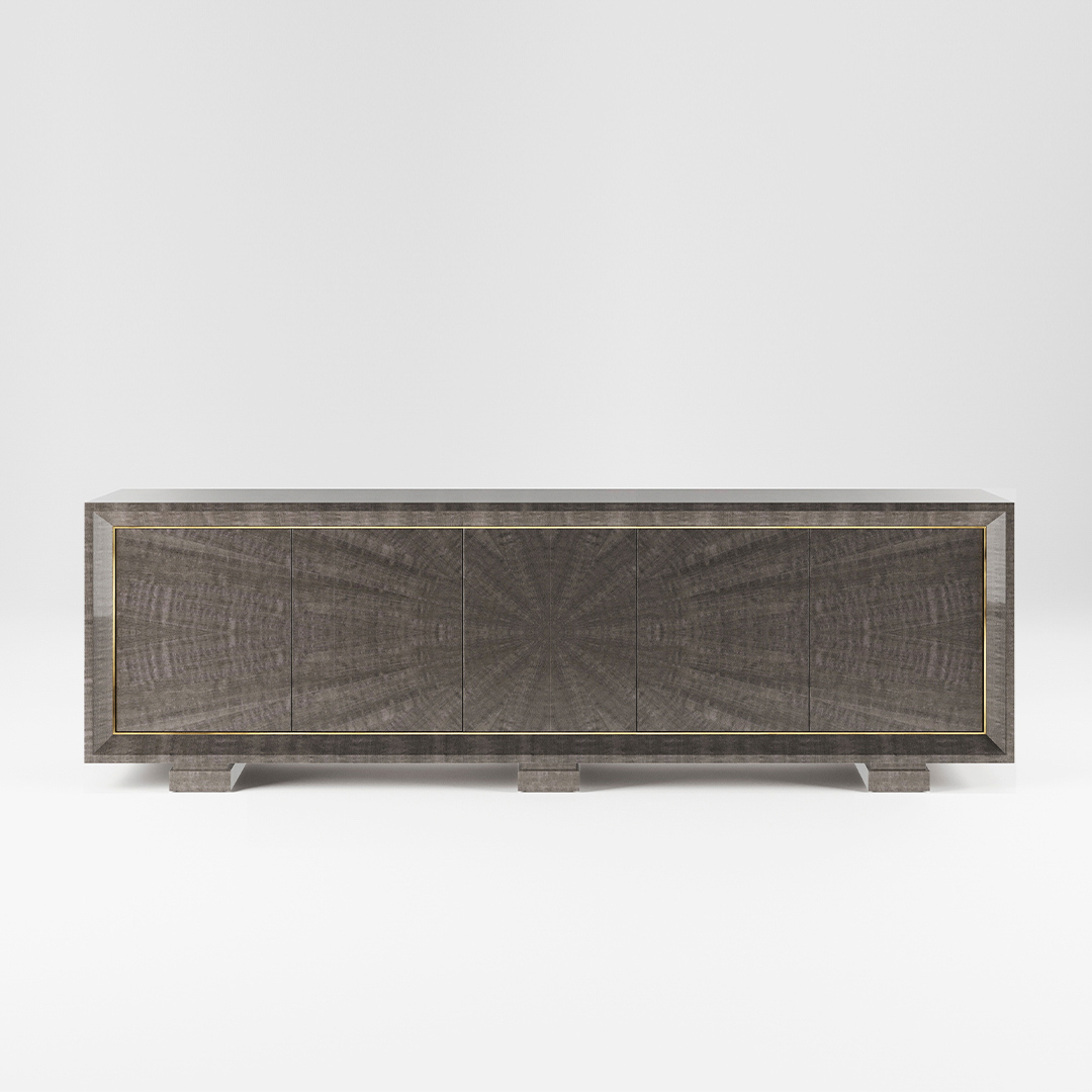 A five door sideboard finished in a high gloss pebble grey anegre with a polished brass trim. Design by DAVIDSON London.
