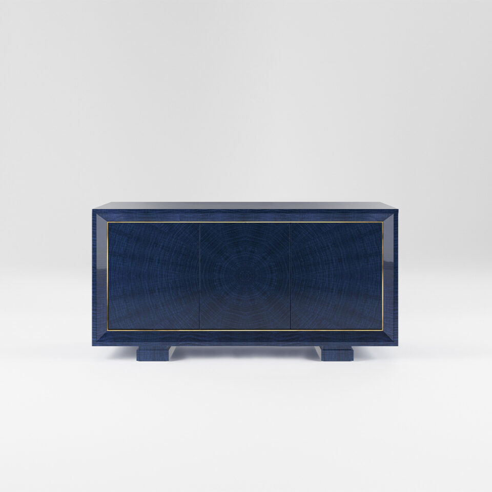 A three door sideboard finished in a high gloss figured blue eucalyptus with a polished brass trim. Design by DAVIDSON London.