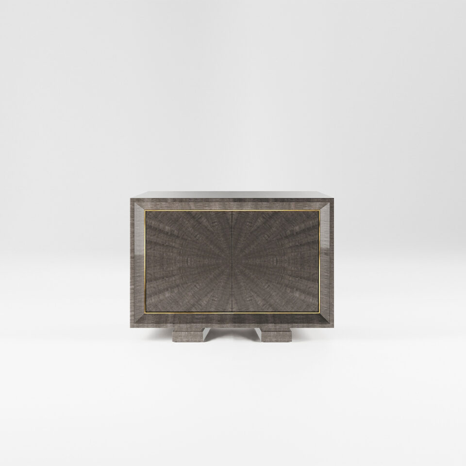 A two door sideboard finished in a high gloss pebble grey anegre with a polished brass trim. Design by DAVIDSON London.