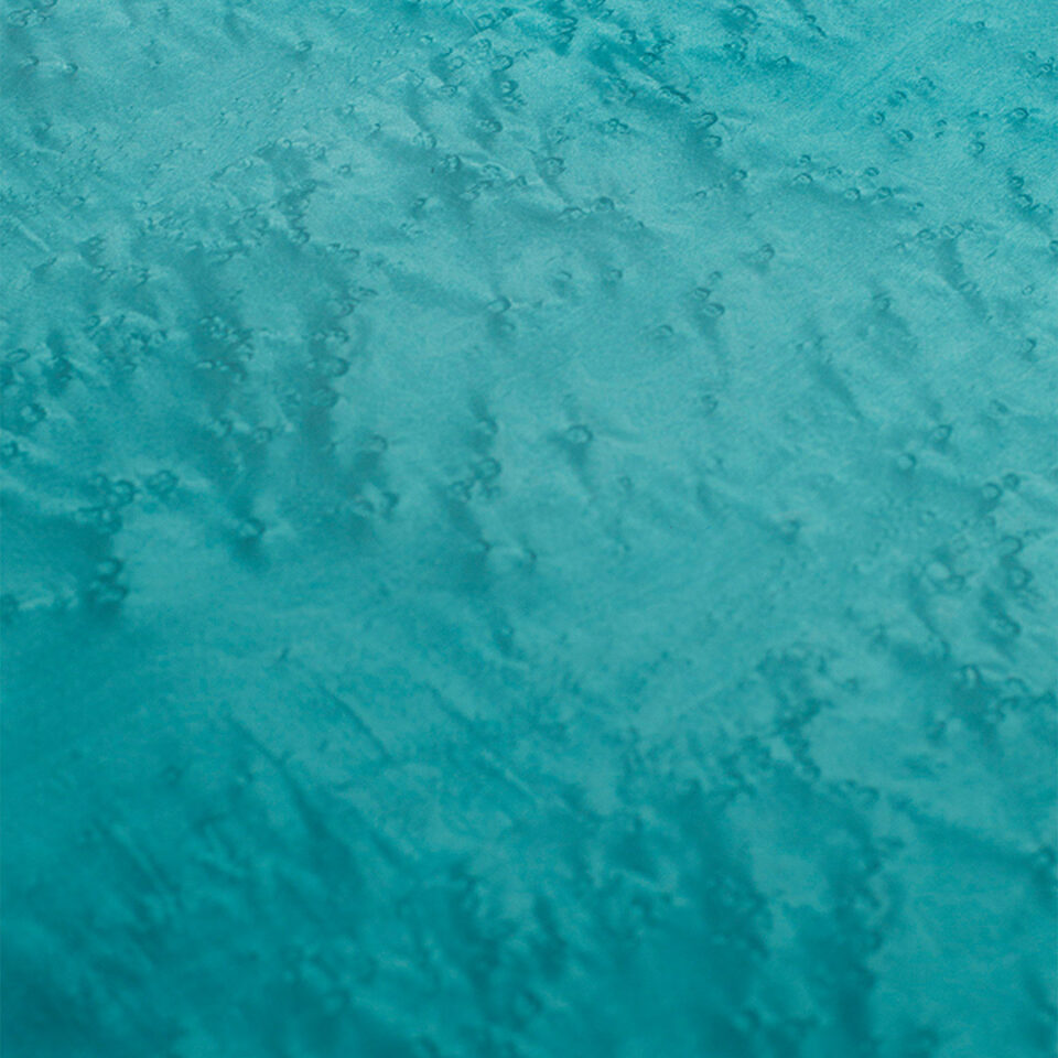 A glamorous coffee table finished in a stylish high gloss blue birdseye maple