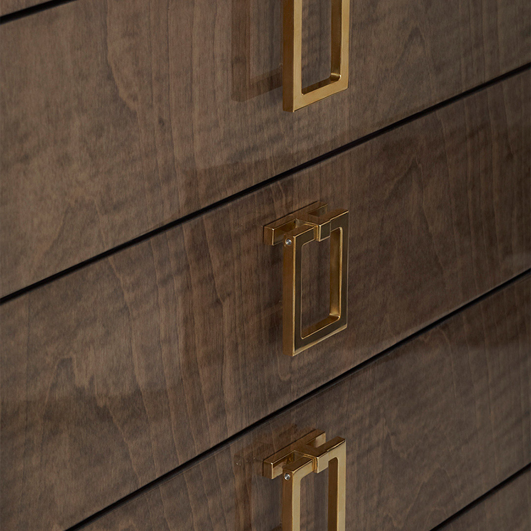 A classic DAVIDSON sideboard finished in a high gloss sycamore dusk with square drop handles in a gleaming polished brass