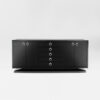 A four door sideboard with a central bank of doors. Finished in a black lacquer with polished nickel handles. Design by DAVIDSON London.