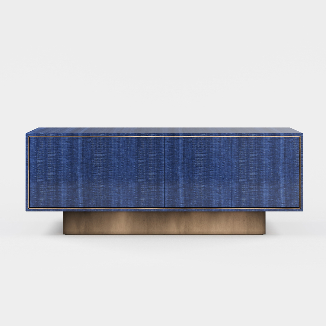 A four door sideboard finished in high gloss figured blue eucalyptus with an antiqued brushed brass plinth. Design by DAVIDSON London.