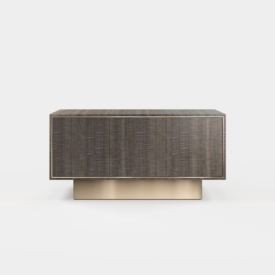 A three door sideboard finished in high gloss pebble grey anegre with a polished brass plinth. Design by DAVIDSON London