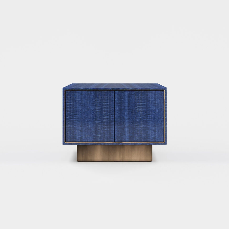 A two door sideboard finished in high gloss figured blue eucalyptus with an antiqued brushed brass plinth. Design by DAVIDSON London.