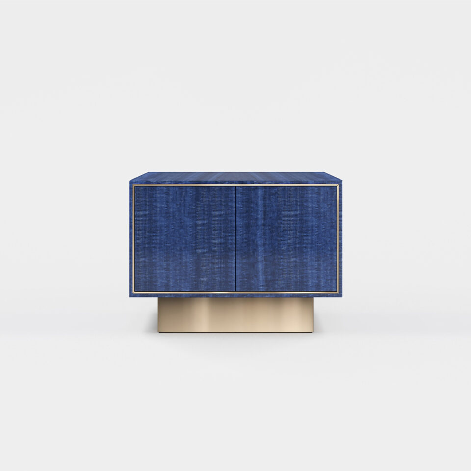 A two door sideboard finished in high gloss figured blue eucalyptus with a polished brass plinth. Design by DAVIDSON London
