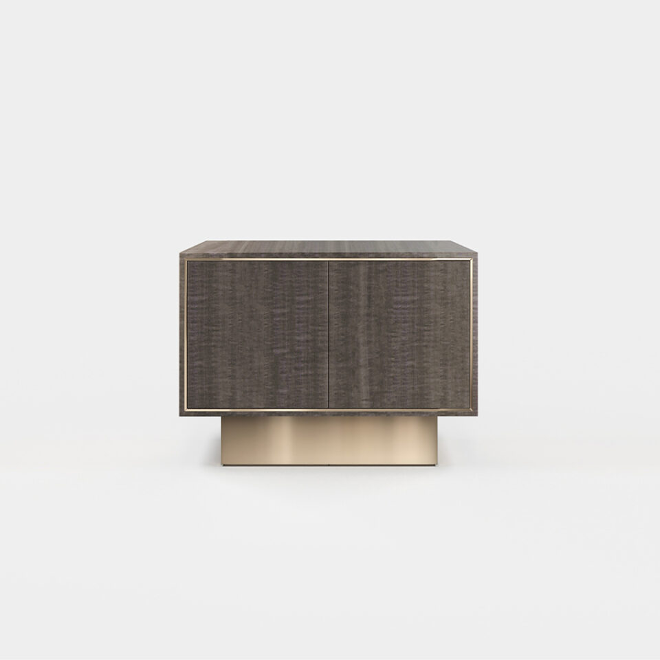 A two door sideboard finished in high gloss pebble grey anegre with a polished brass plinth. Design by DAVIDSON London