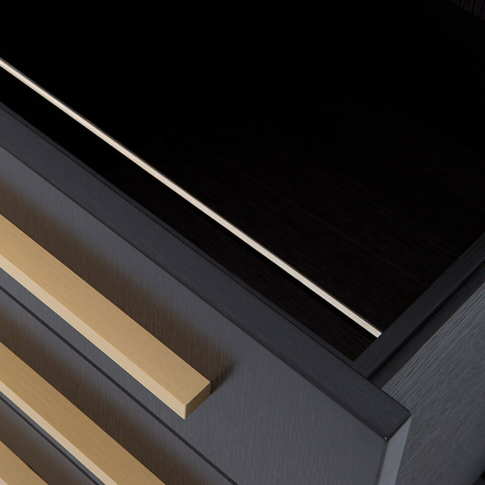 A smart, sleek office solution with ample storage finished in an exquisite satin dark tinted oak with rectilinear handles in brushed brass