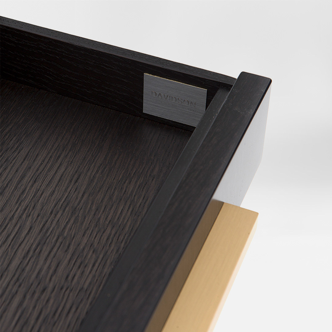 A smart, sleek office solution with ample storage finished in an exquisite satin dark tinted oak with rectilinear handles in brushed brass