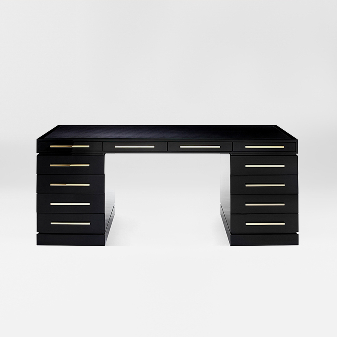 A smart, sleek desk finished in an exquisite sycamore black with rectilinear handles in polished brass. Design by DAVIDSON London