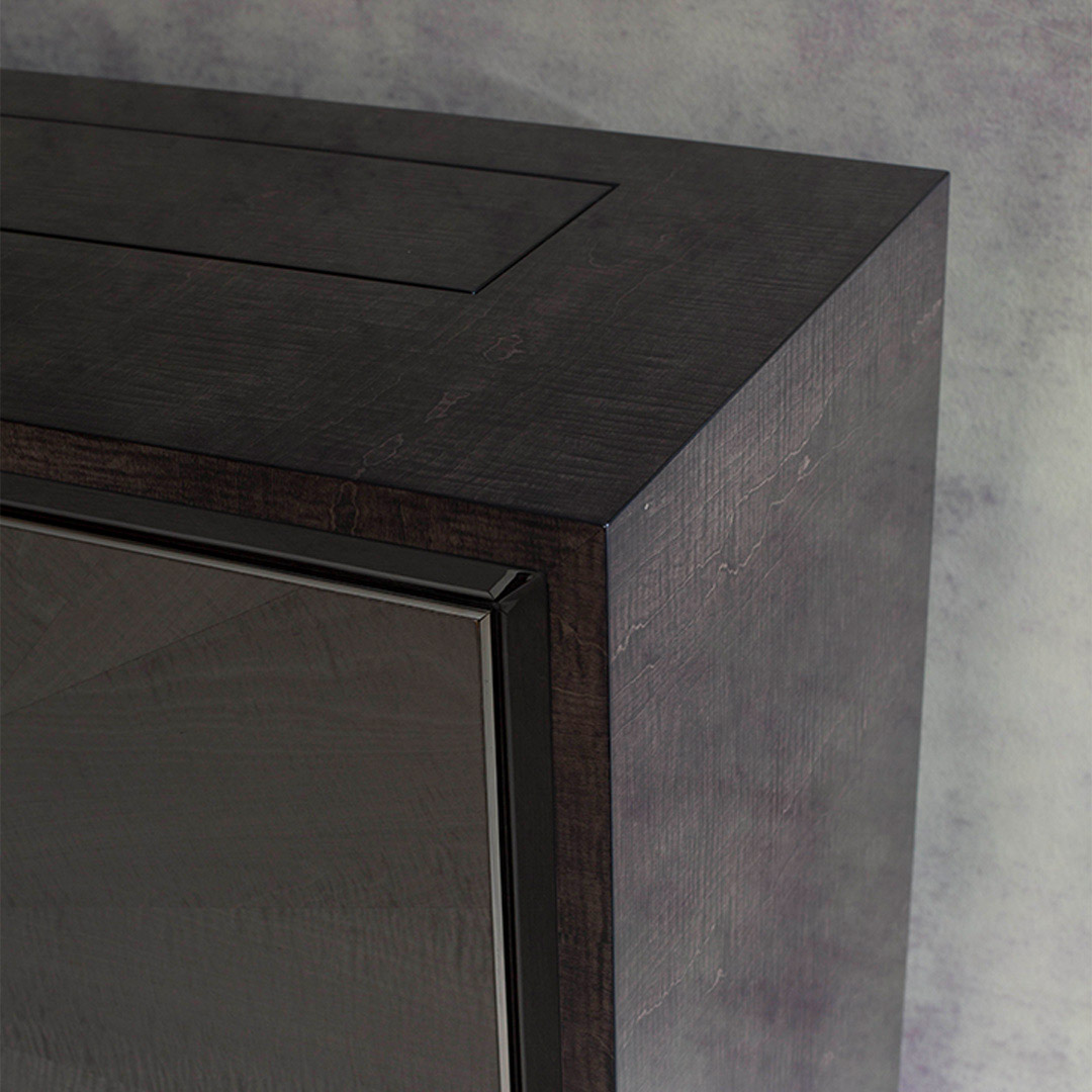 A timeless sideboard finished in two tones of sycamore grey and sycamore slate with a radial pattern to the doors and opulent polished nickel trim and handles inlaid with shagreen