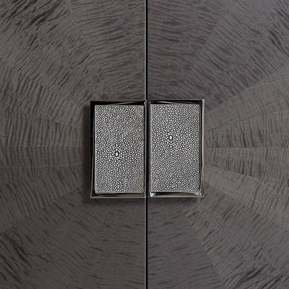 A timeless sideboard finished in two tones of sycamore grey and sycamore slate with a radial pattern to the doors and opulent polished nickel trim and handles inlaid with shagreen