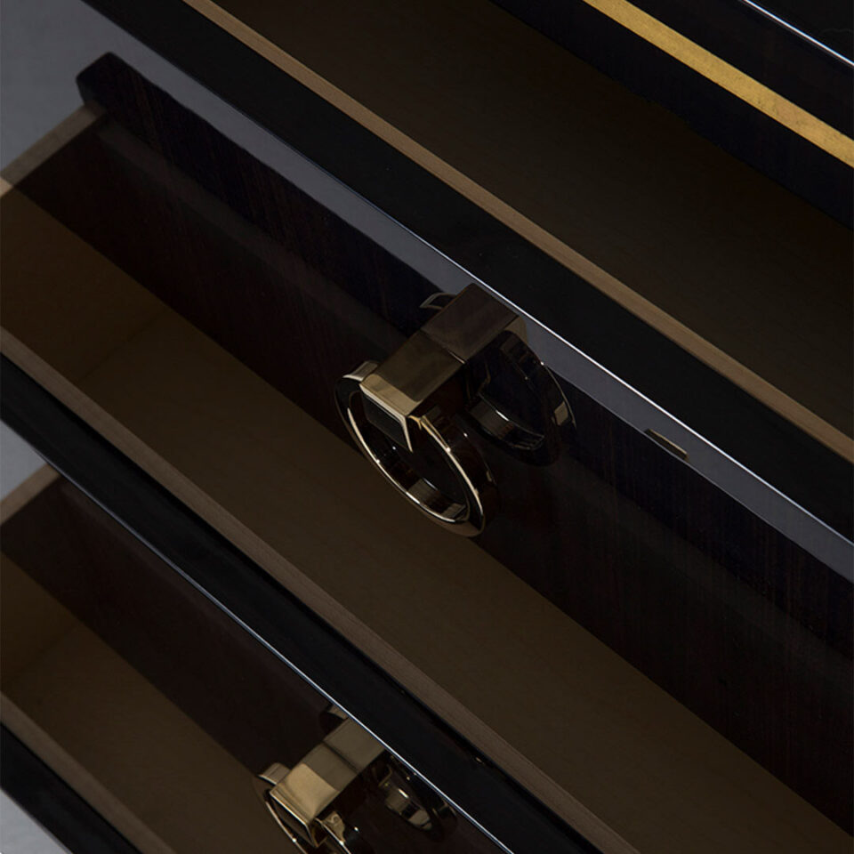 The Hatfield Bedside chest drawer detail in high gloss sycamore black with glamorous round drop handles in a polished nickel