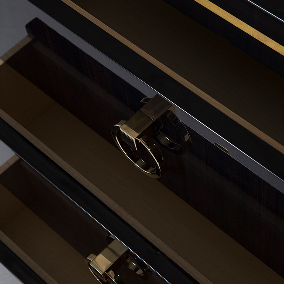 The Hatfield Bedside chest drawer detail in high gloss sycamore black with glamorous round drop handles in a polished nickel