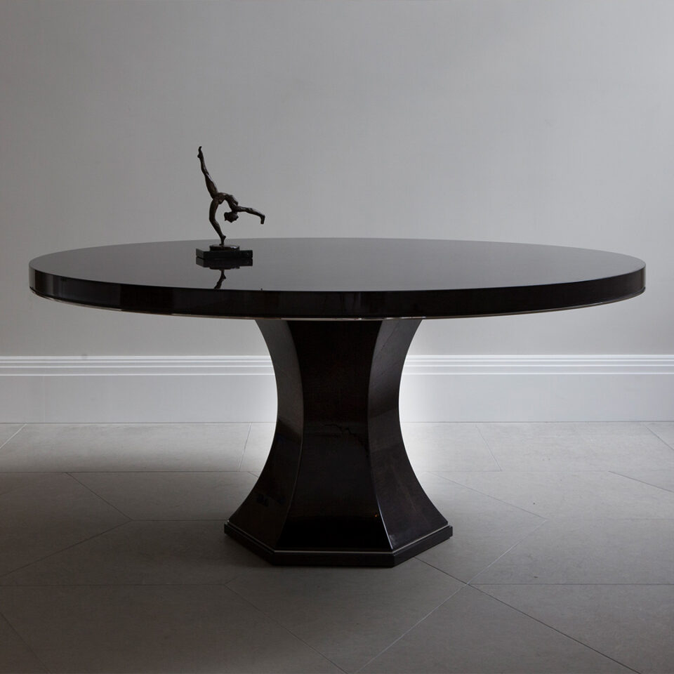 Black round Chatsworth Table on a grey background