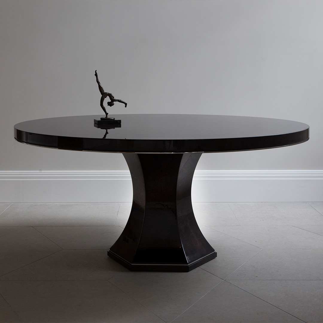 Black round Chatsworth Table on a grey background
