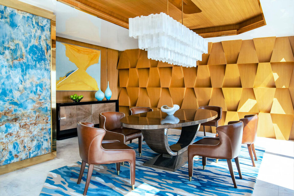 The Dining Room in this luxury Bangkok Penthouse. Featuring Davidson's Ovington Dining Table and Hanover Sideboard with a beautiful textured accent wall and other blue highlights.