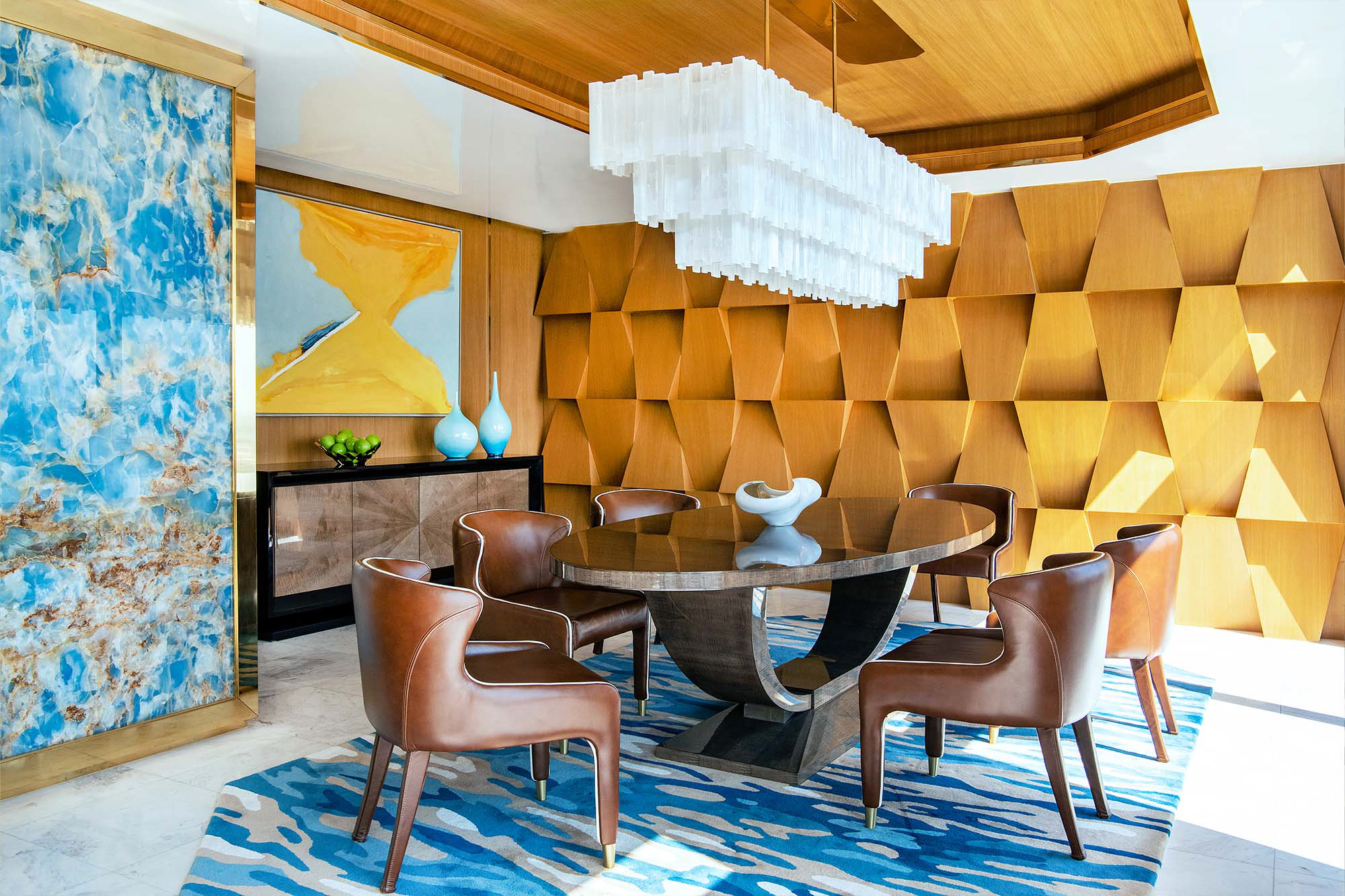 The Dining Room in this luxury Bangkok Penthouse. Featuring Davidson's Ovington Dining Table and Hanover Sideboard with a beautiful textured accent wall and other blue highlights.