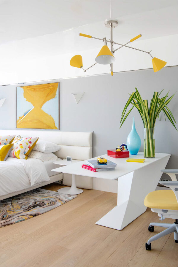 A secondary bedroom in this Bangkok Penthouse. A calming, neutral room with bright yellow accents.