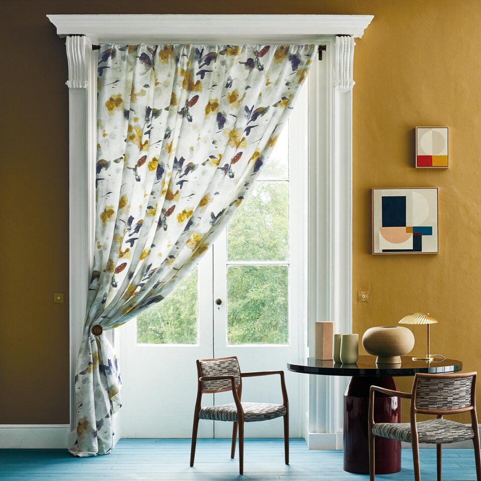 The Crayon Dining Table by DAVIDSON London is finished with a deep red gloss lacquer base and sea blue gloss lacquer top. Beautifully styled by Olivia Gregory for ROMO Black Edition.