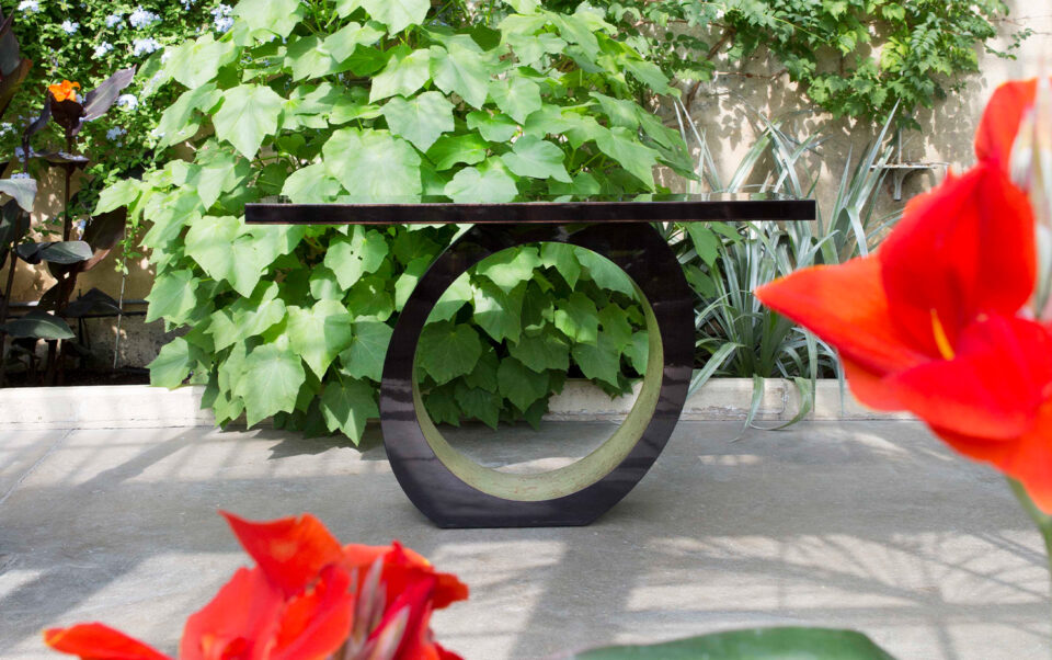 A luxury modern console table perfect for spring being used outdoors.