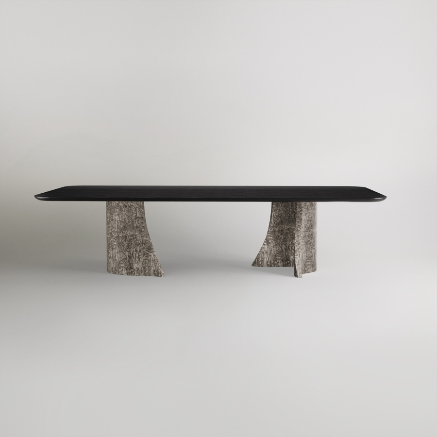 Unique dining table with sculptural silver base on a grey background